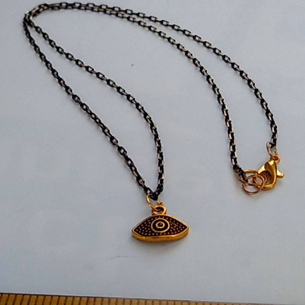 Golden black all seeing eye necklace